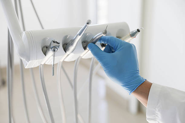 Professional Tooth Extraction technician working in Louisville, MS